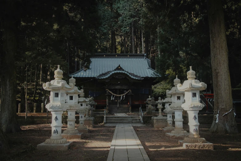 an archway with statues at the entrance to a shrine
