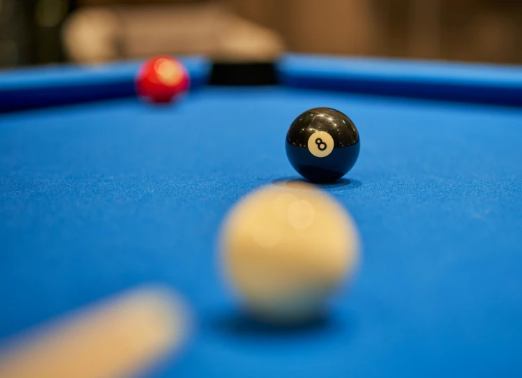 a billiard table and two pool balls