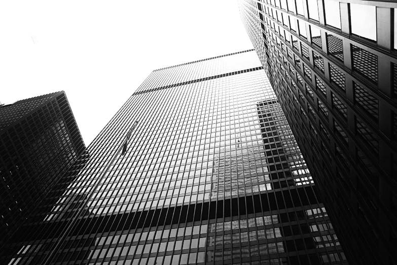 a tall building with lots of windows and a sky view