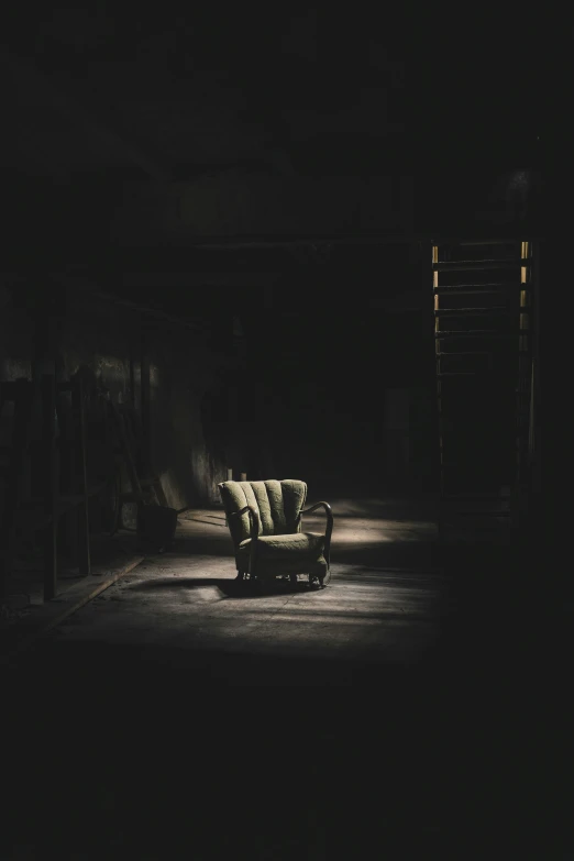 a couch sits alone in the dark of night