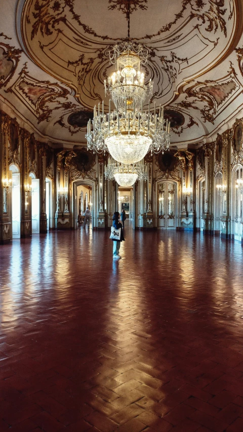 an ornate, elaborate room with mirrors and chandeliers