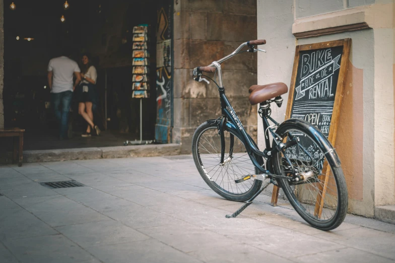 a bike is  up outside of a restaurant