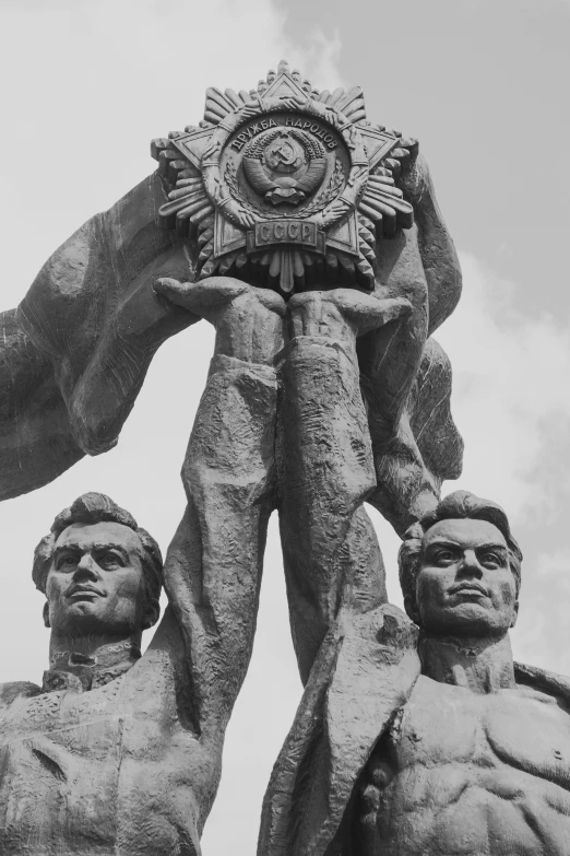 a large statue of two people that are near each other