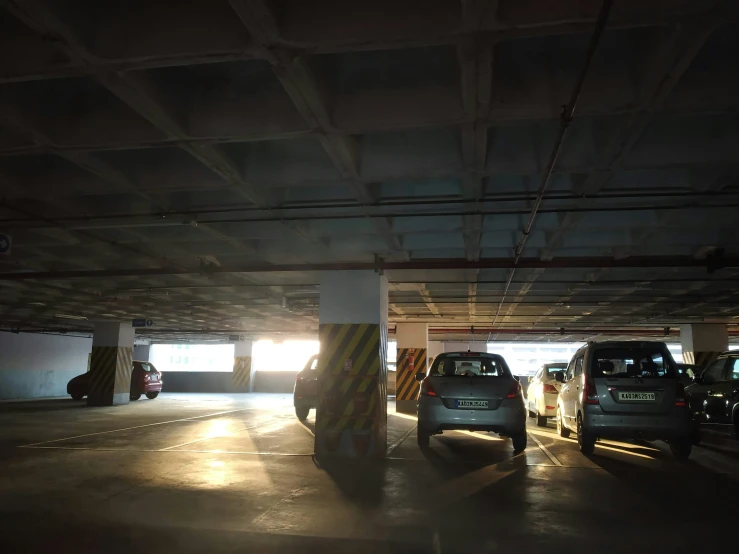a parking garage filled with lots of vehicles