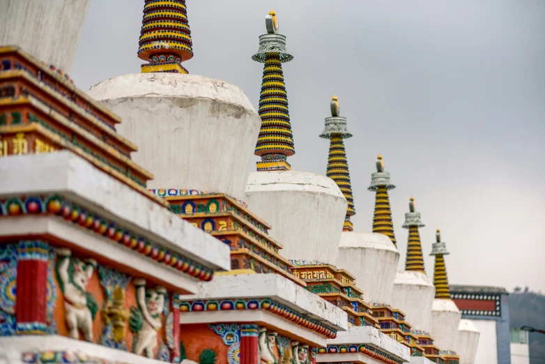 the top of a building with brightly painted roof tops