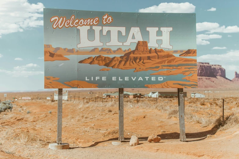 a sign for a desert welcomes visitors to utah