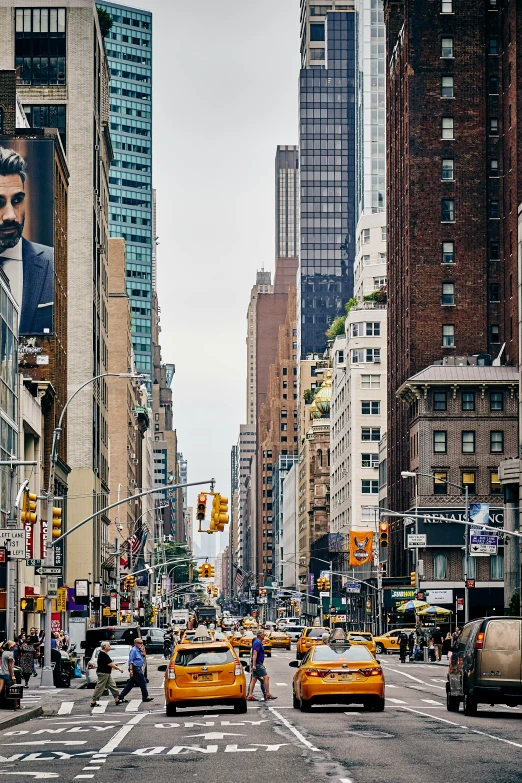 a street filled with traffic and lots of tall buildings