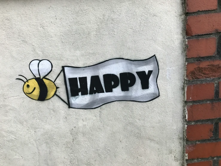 a bee painted on the wall of a building