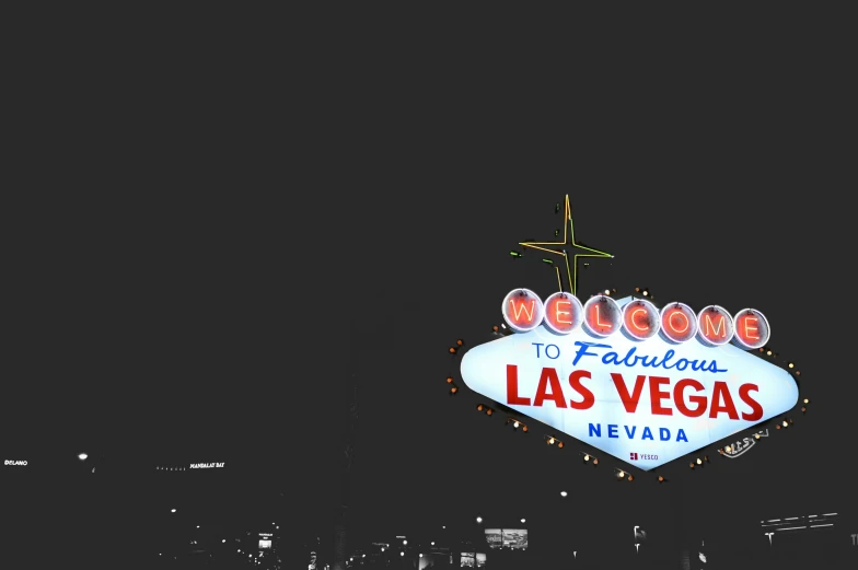 the las vegas sign that is lit up for the holiday