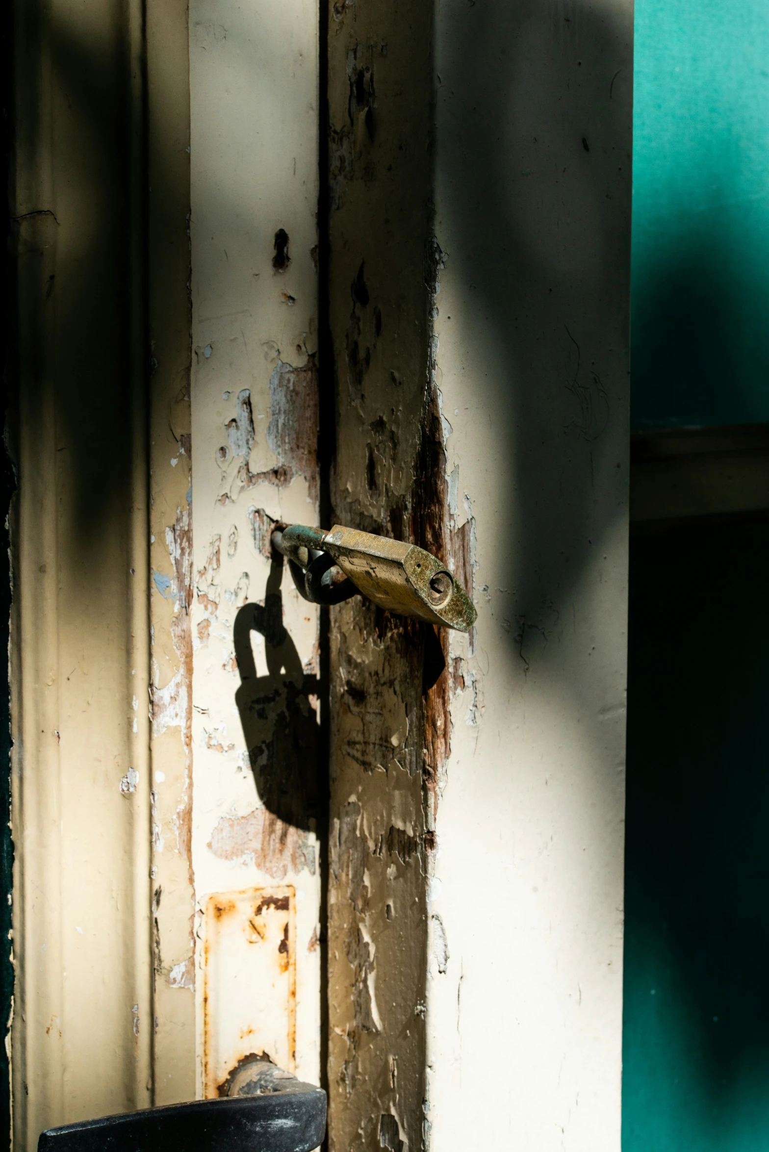 this po shows a rusted padlock on a door