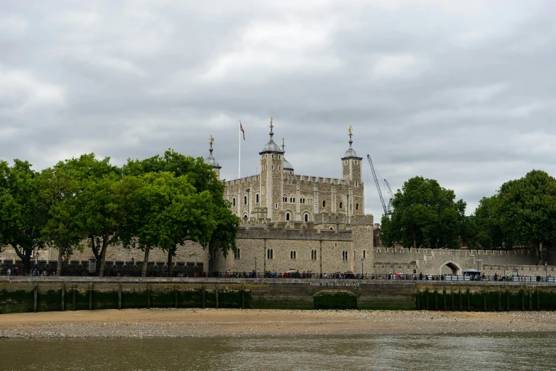 the castle is sitting on the river bank