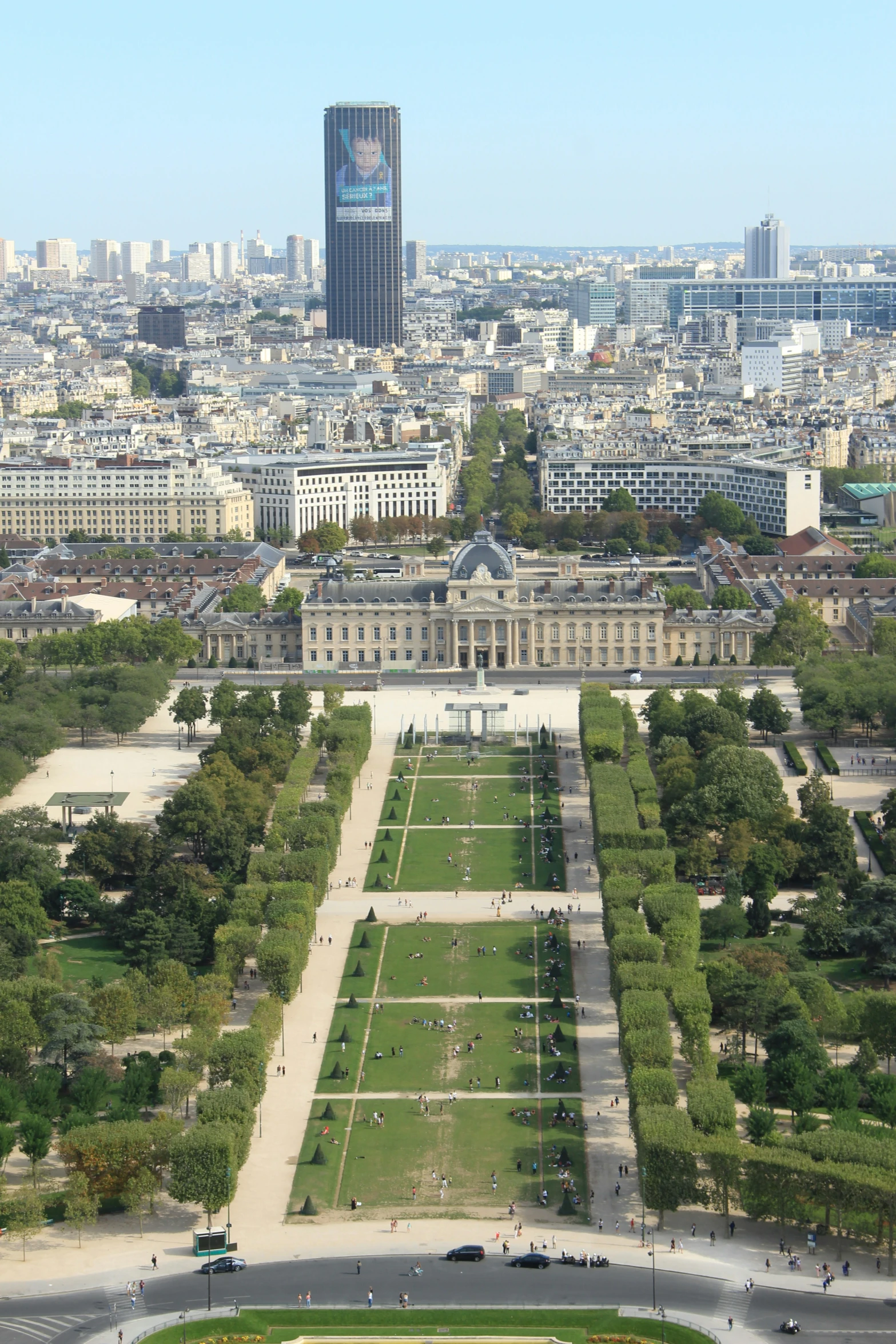 an aerial view of the city with a large lawn