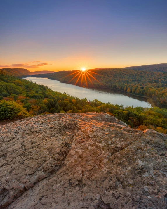 a beautiful view at sunset from top of a hill