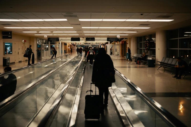 a po of a person at the airport waiting for the luggage