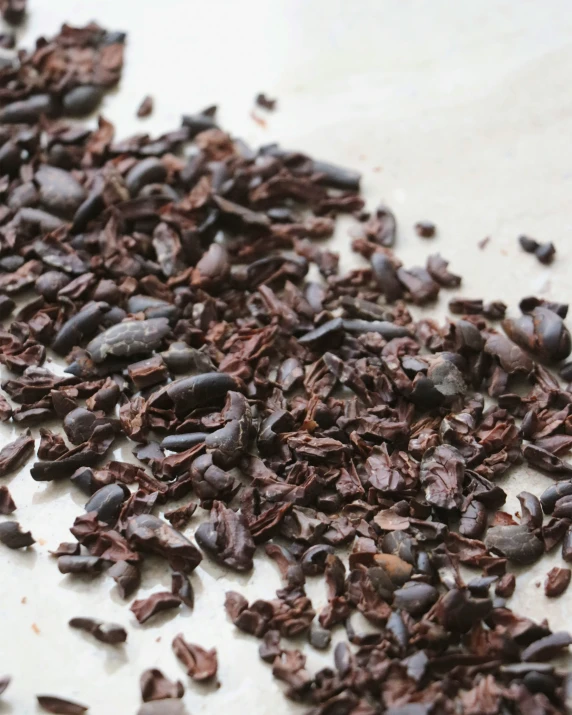 close up s of chocolate chips spilling out onto a white surface