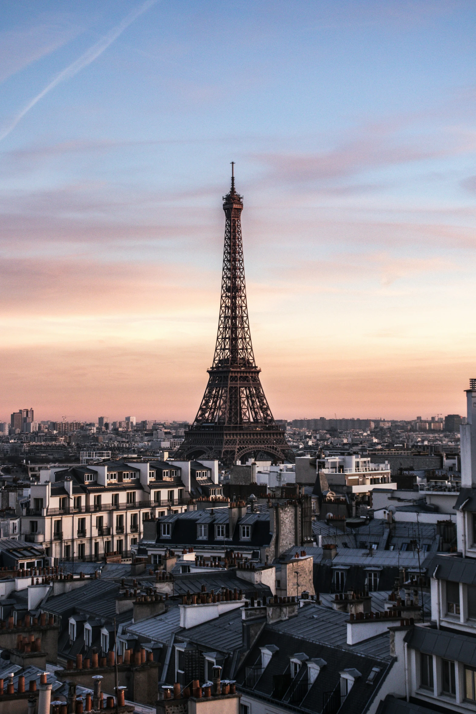 a very tall tower with a sky in the background