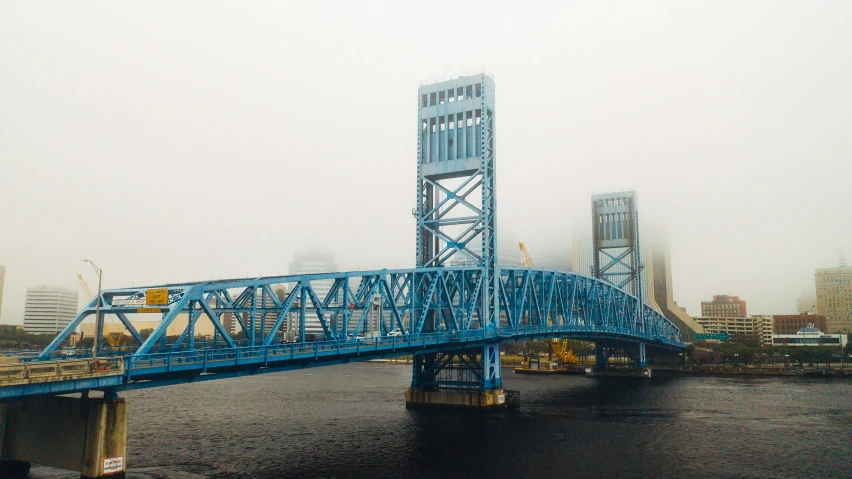 an image of a bridge going across the river