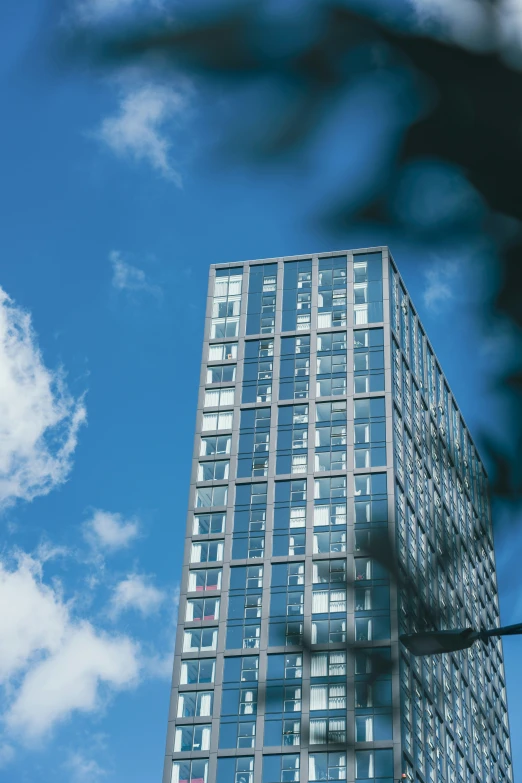 looking up at an office building from the ground