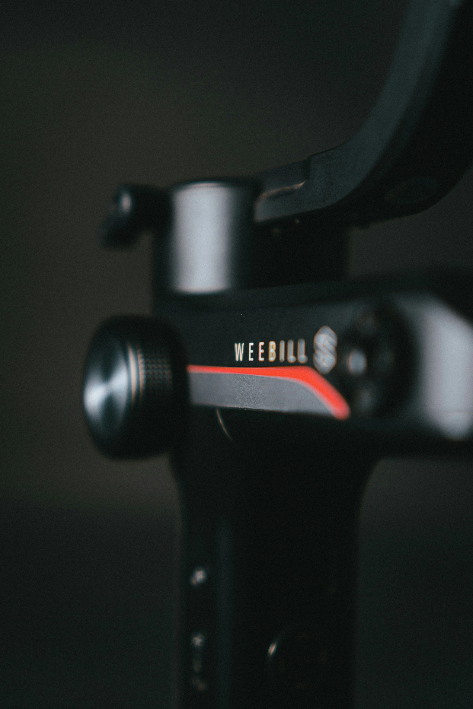 a close up of a bike handlebar with a black background