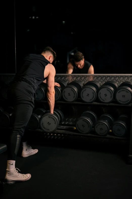 two men are working out in the gym