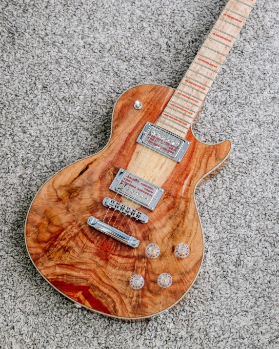 a guitar made out of ze wood is on display