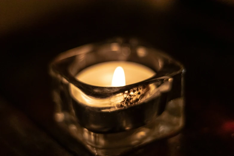 a candle sitting on top of a wooden table