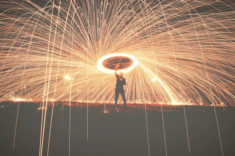 a man standing in the middle of fireworks