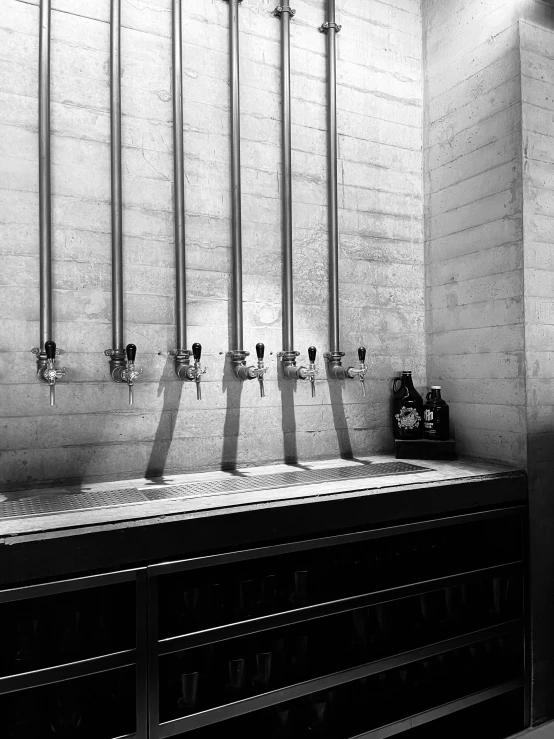 three empty cups line up against a row of mirrors