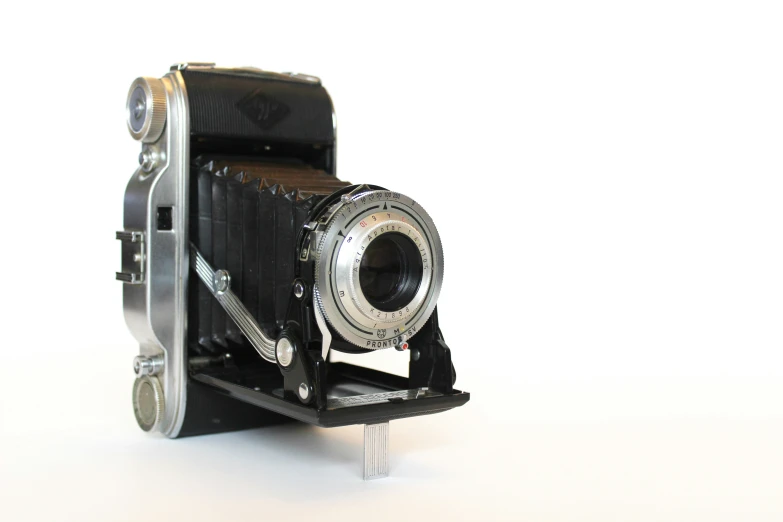 a small black and silver camera that has no lens