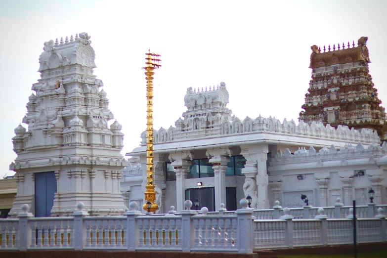 a building with a tall white tower on top