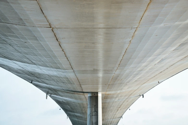 looking up at a bridge's top and bottom section