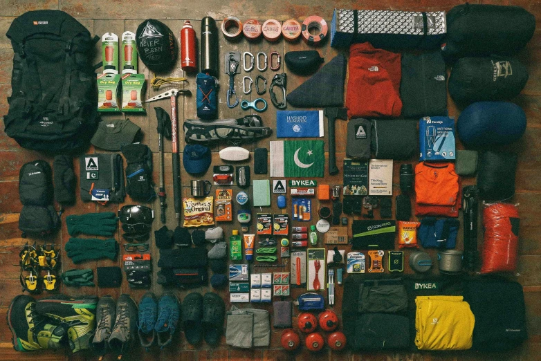 a large assortment of sports equipment, including shoes and baseball gear