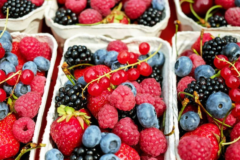 baskets filled with berries on a table