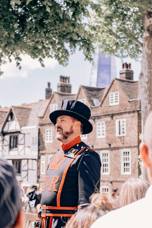 a man dressed in uniform stands outside