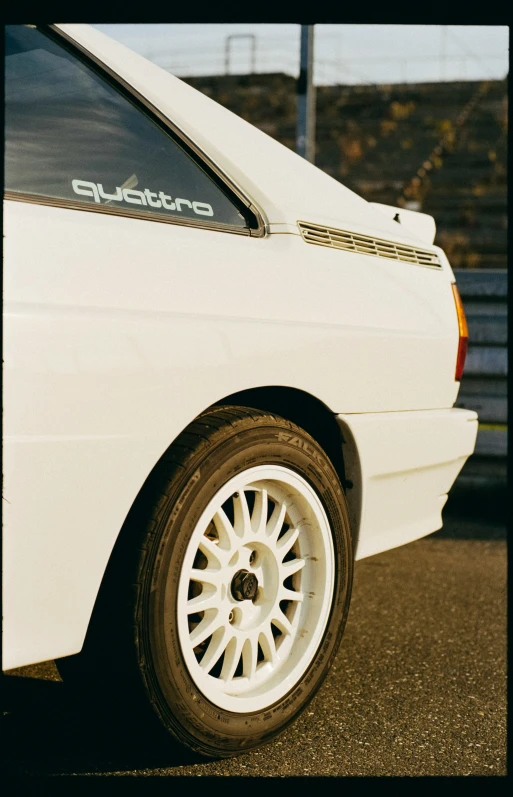 a white car parked in a parking lot