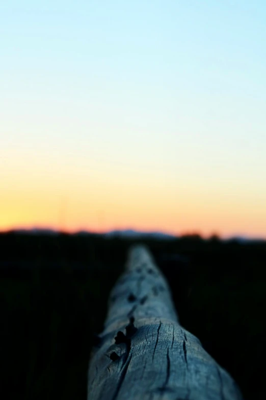 an up close view of a wooden fence post