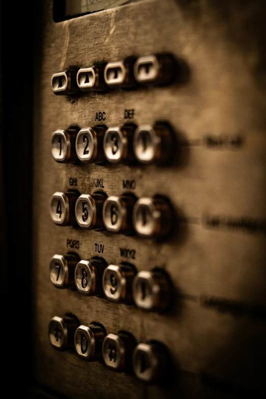old fashioned phone on controls in sepia pograph