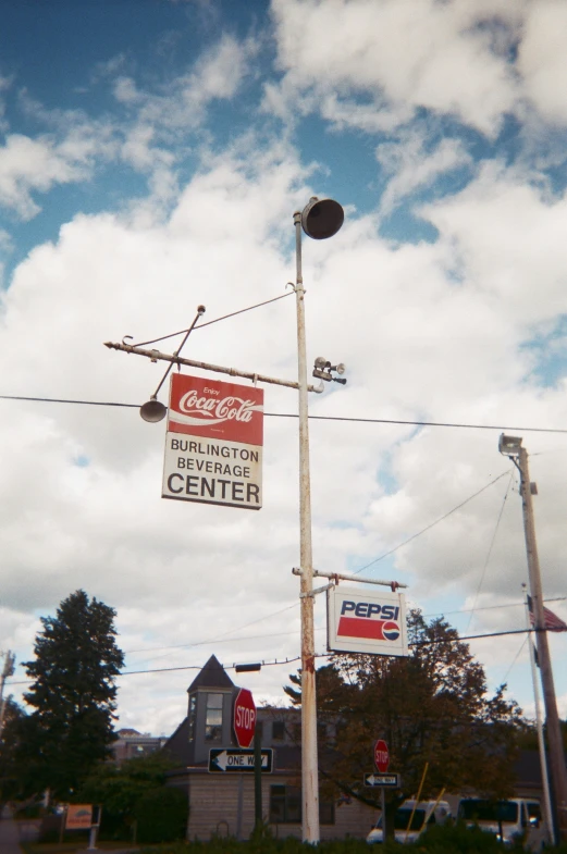 a building with a street sign and stop light in the foreground