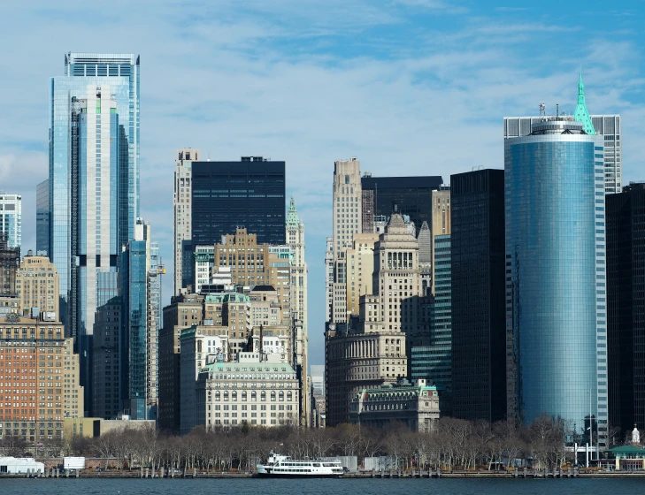 a view of a lake that has the city skyline in the background