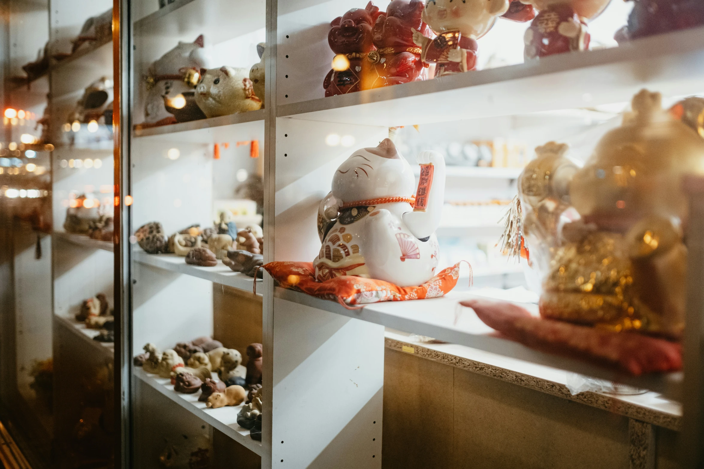 a teddy bear display in a store filled with lots of items