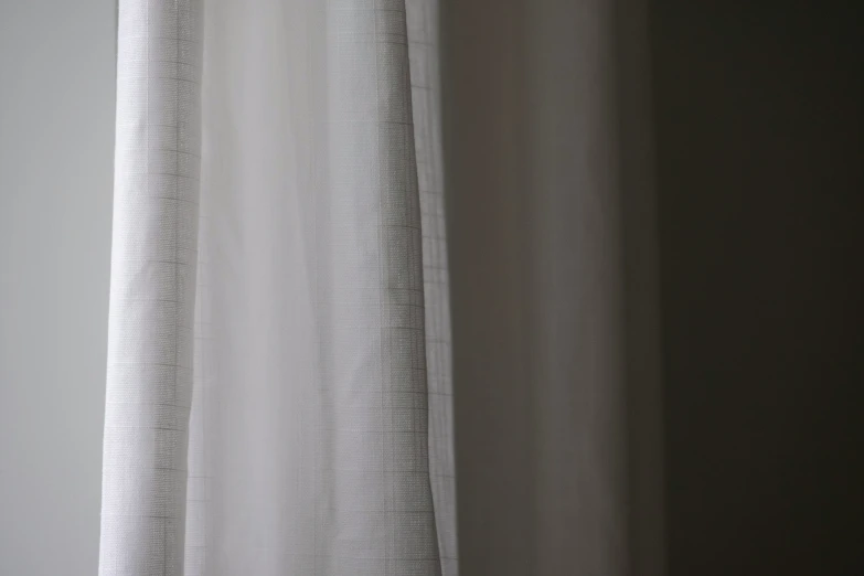 a curtain hanging in front of a window