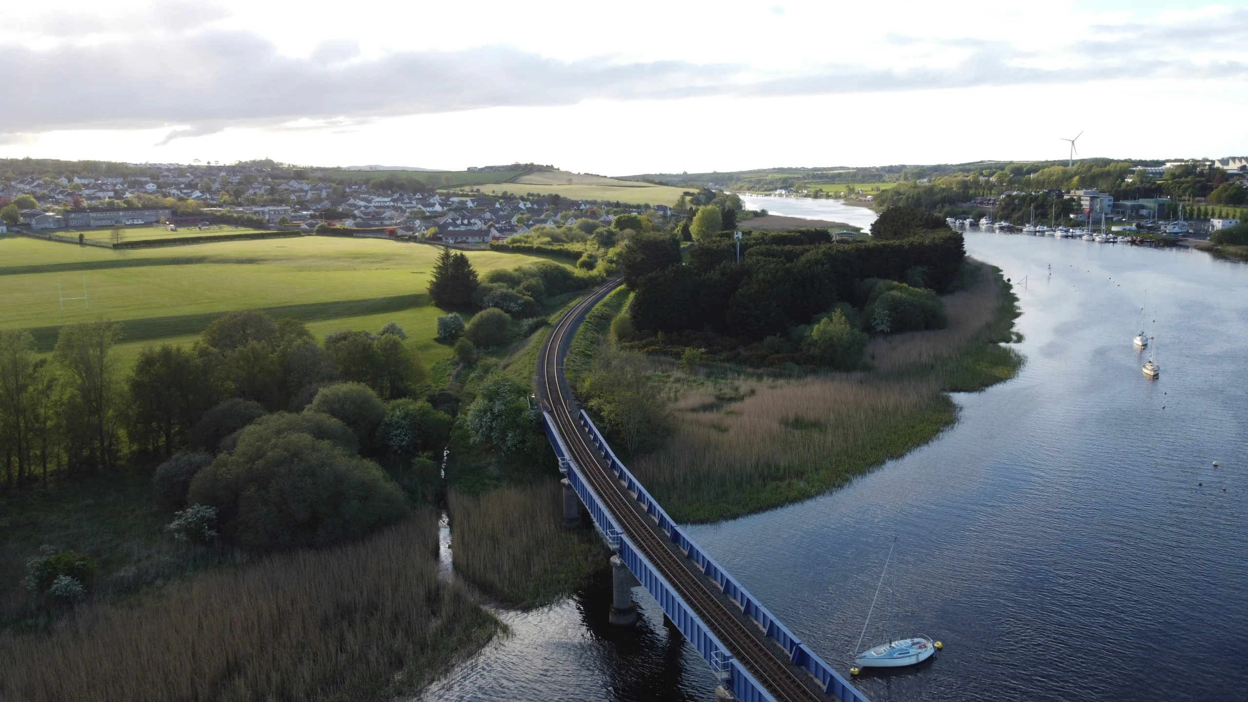 the top view of a train traveling over the water