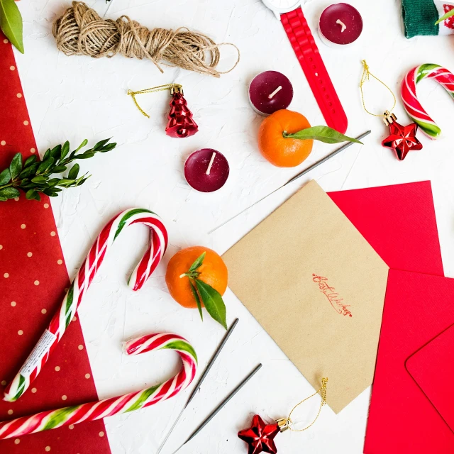 many cards are on the table with holiday decorations