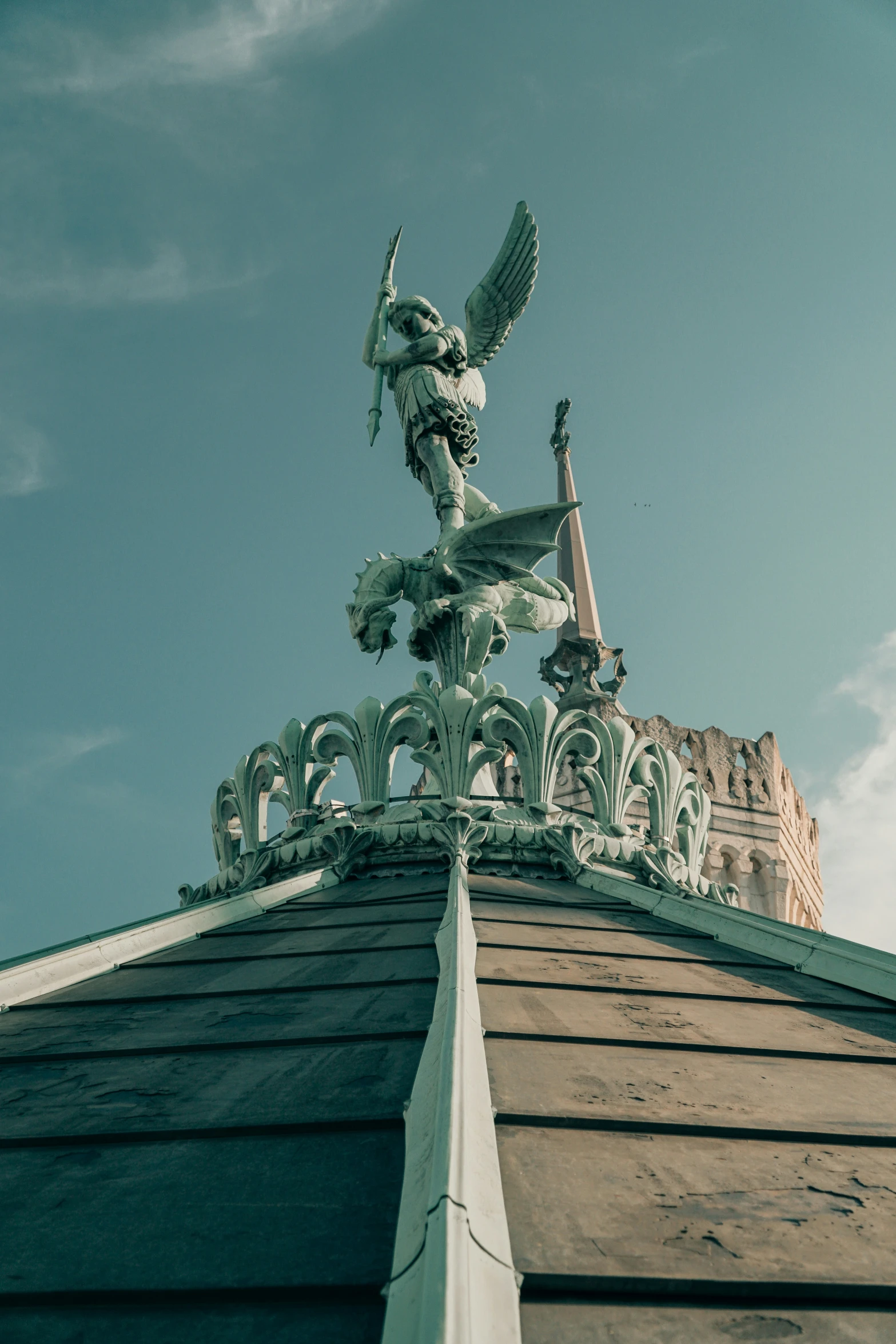 a close up of a roof with an ornate winged dragon