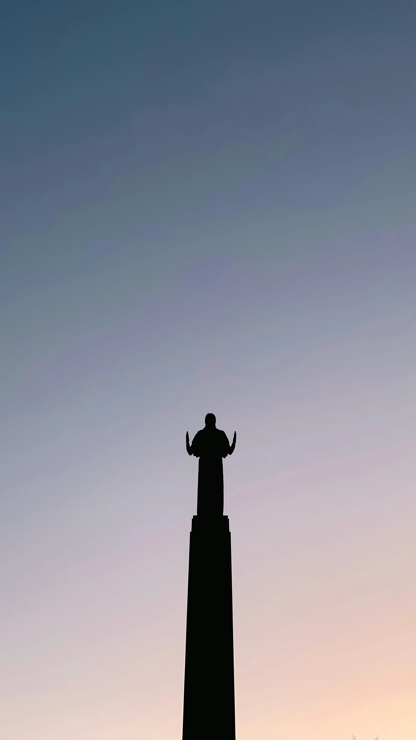 a person that is standing on top of a building