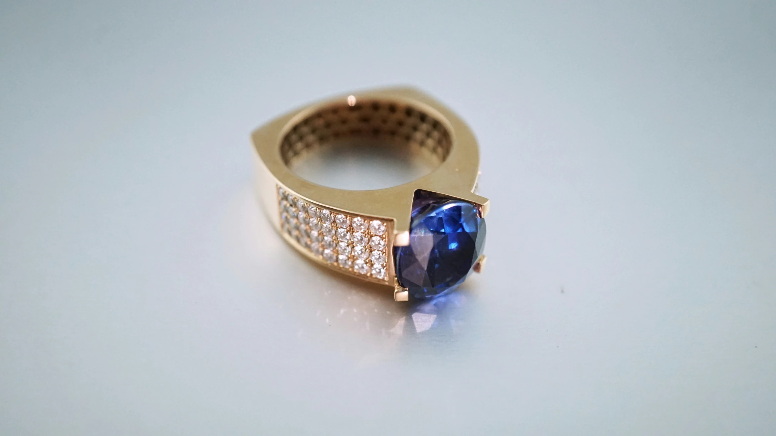 an elegant ring is set with a sapphire stone