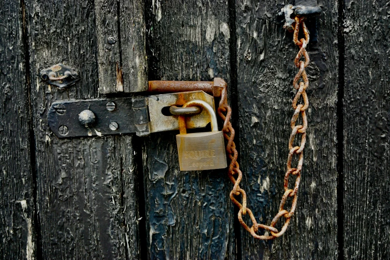 a locked door with a rusted lock