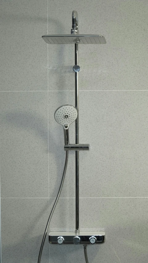 a shower head with the handle open and a hand held showerhead