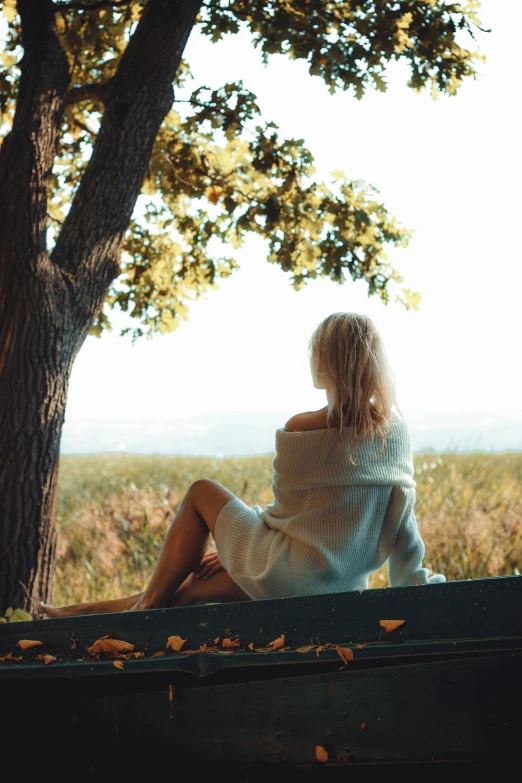 woman with her hands on hips looking at the horizon