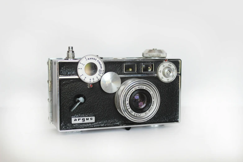 an old fashion camera with flash and the lens pointed upward